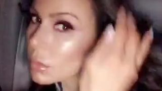 Kendra Lust onlyfans busty  cam girl  caresses her lips.