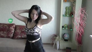 trisha_tanaka dancing near the christmas tree