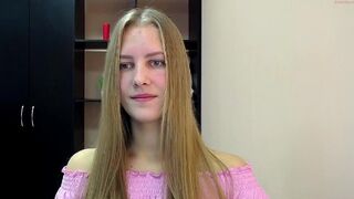 lilian_l sexy teen  is playing with two toys in a show