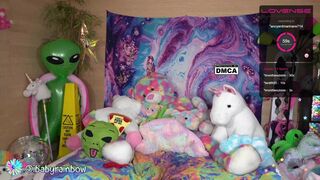 babyrainbow Sexy baba in glasses coolly playing pranks with a sex toy