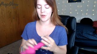 tawneyssexed busty  cam girl  caresses her lips.